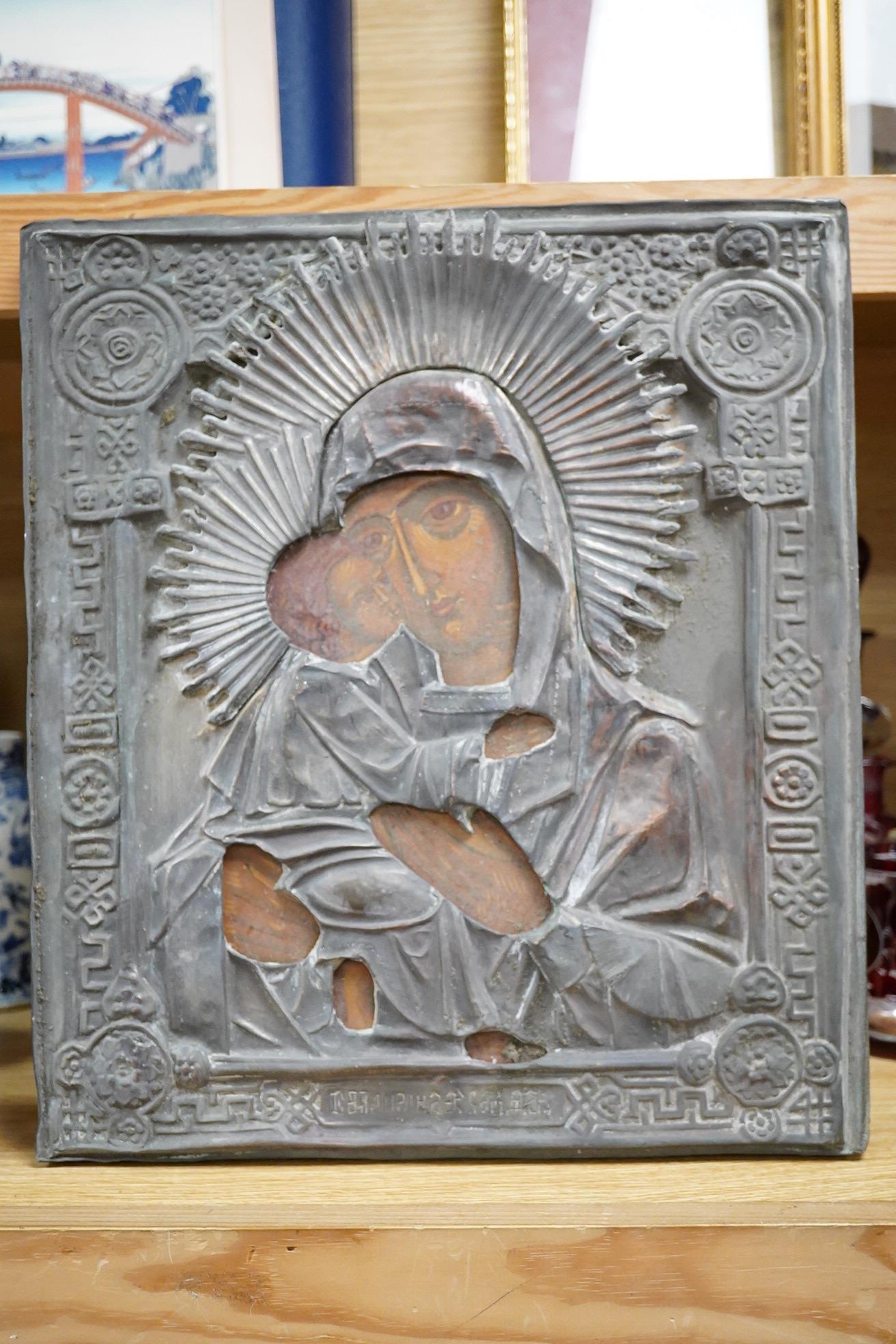 A Russian overlaid icon and a printed icon, largest 35 x 30cm